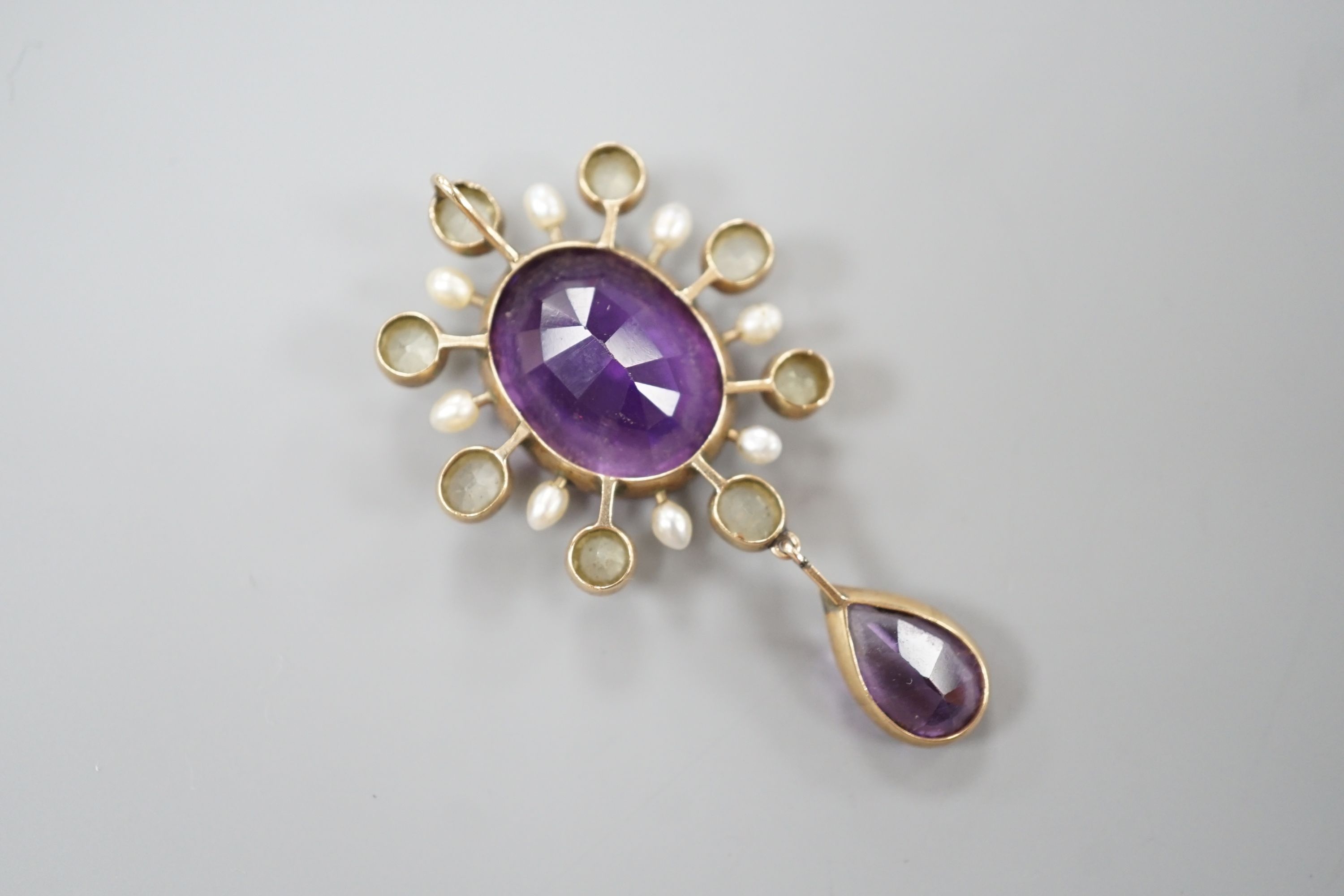 An early 20th century yellow metal, amethyst, olivine, and baroque pearl set drop pendant, 47mm, gross weight 5.4 grams.